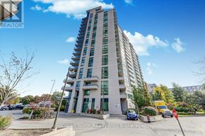 Toronto (Woburn) condo for rent - A tall building with a parking lot in front of it.