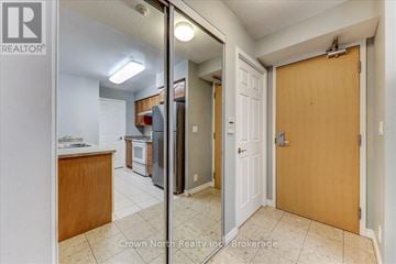 Toronto (Woburn) condo for rent - A kitchen with a refrigerator, oven, and sink is shown in a real estate listing.