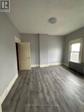 St. Catharines (E. Chester) triplex for rent - A room with a door and a window.