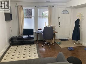 Vancouver apartment for rent - A room with a desk, chair, and a computer monitor.