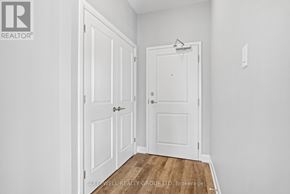 Russell multi-family for rent - A white door is in a room with a wooden floor.
