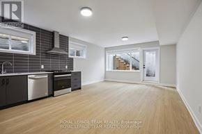 Ottawa apartment for rent - A kitchen with wooden floors and a stainless steel dishwasher.