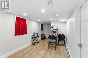 St. Catharines (E. Chester) apartment for rent - A room with a red curtain and two chairs.