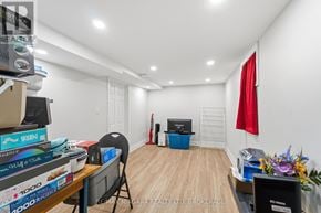 St. Catharines (E. Chester) apartment for rent - A room with a desk, chair, and a red flag on the wall.