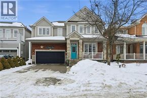 Hamilton apartment for rent - A house with a blue door and a sign that says "For Sale" is surrounded by snow.