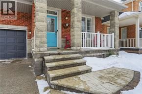 Hamilton apartment for rent - A house with a blue door and a stone pillar.