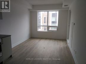 Markham (Unionville) condo for rent - A room with a window and a wooden floor.