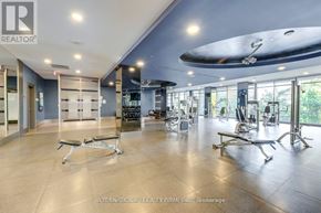 Toronto (Willowdale West) condo for rent - A gym with a surfboard hanging from the ceiling.