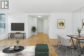 Toronto (Rosedale-Moore Park) condo for rent - A living room with a black coffee table and a grey sofa.