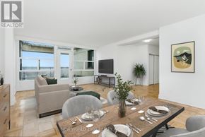 Toronto (Rosedale-Moore Park) condo for rent - A modern dining room with a wooden table set for two.