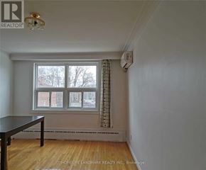 Toronto (Mimico) apartment for rent - A room with a table and a window.