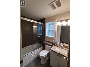 New Westminster apartment for rent - A bathroom with a toilet, sink, and shower.