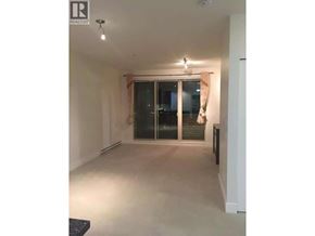 Vancouver apartment for rent - A spacious room with a sliding glass door and a black bench.