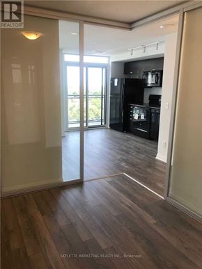 Toronto (Woburn) condo for rent - A kitchen with a refrigerator, oven, and microwave.