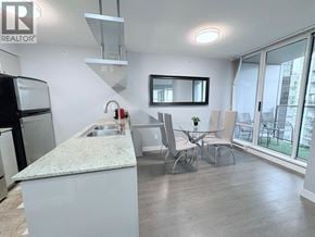 Vancouver apartment for rent - A kitchen with a granite countertop and a sink.