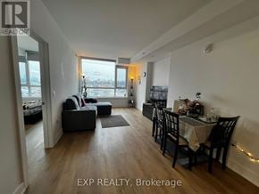 Ottawa condo for rent - A living room with a dining table and chairs.
