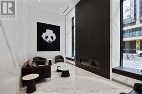 Toronto (Bay Street Corridor) condo for rent - A living room with a panda painting on the wall.