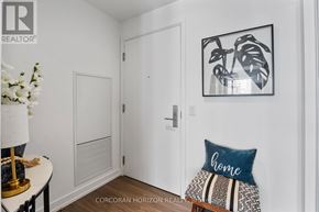 Toronto (Bay Street Corridor) condo for rent - A white door with a white wall and a picture hanging on the wall.