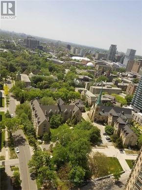 Toronto (Bay Street Corridor) condo for rent - A bird's eye view of a residential area with houses and trees.