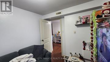 London North (North N) apartment for rent - A living room with a couch and a doorway leading to another room.