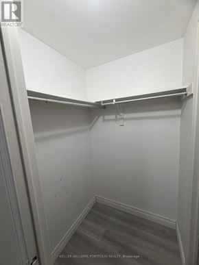 Toronto (Malvern) apartment for rent - A small, empty walk-in closet with a grey carpet.