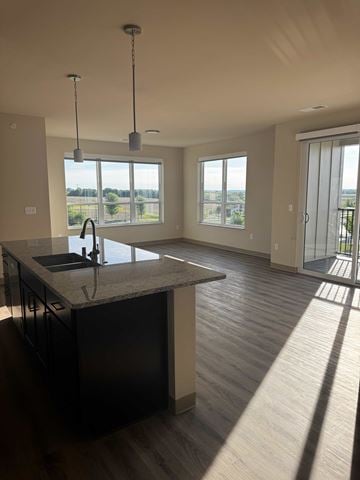Mt Horeb apartment for rent - A kitchen with a sink and a countertop with a window in the background.