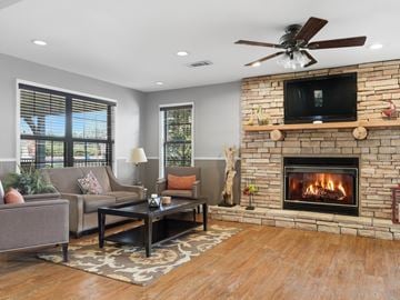 Clarkesville apartment for rent - A living room with a fireplace and a television on the wall.