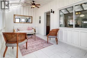 Kitchener apartment for rent - A room with a ceiling fan and two chairs.