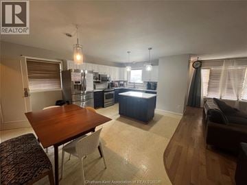 Chatham apartment for rent - A well-lit kitchen and dining area with a wooden table and chairs.