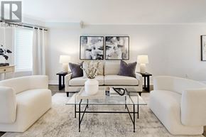 Pickering (Highbush) apartment for rent - A living room with white furniture and a large painting on the wall.