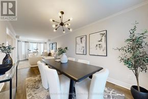 Pickering (Highbush) apartment for rent - A dining room with a black table and white chairs.
