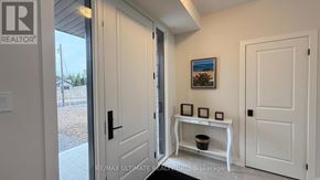 Lake Of Bays (Franklin) apartment for rent - A white door with a black handle is open to a hallway.
