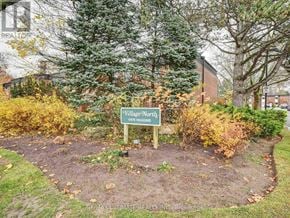 Niagara Falls (Stamford) townhouse for rent - A sign in a garden that says Village Worthy.