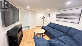 Toronto (O'connor-Parkview) apartment for rent - A living room with a blue couch and a wooden coffee table.