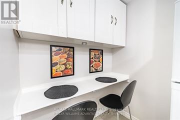 Toronto (Corso Italia-Davenport) apartment for rent - A white kitchen with a table and chairs.