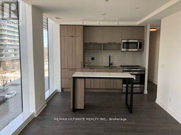 Toronto (Waterfront Communities) condo for rent - A kitchen with a table and chairs in front of a window.