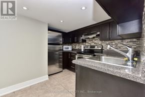 Toronto (Dovercourt-Wallace Emerson-Junction) apartment for rent - A modern kitchen with stainless steel appliances and a granite countertop.