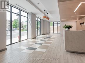 Toronto (Stonegate-Queensway) condo for rent - A spacious office lobby with a reception desk and large windows.