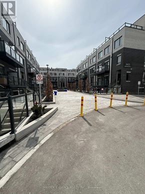 Toronto (Tam O'shanter-Sullivan) townhouse for rent - A street view of a building with a no parking sign.