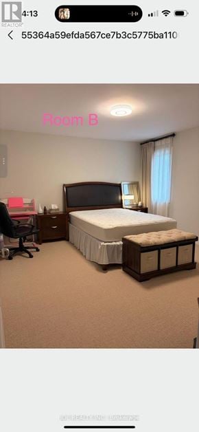 Newmarket (Stonehaven-Wyndham) apartment for rent - A bedroom with a bed, nightstand, and chair.