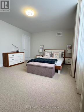 Newmarket (Stonehaven-Wyndham) apartment for rent - A bedroom with a bed, nightstand, and dresser.