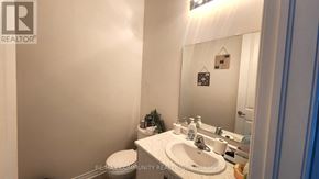 Georgina (Sutton & Jackson's Point) apartment for rent - A bathroom with a sink, toilet, and mirror.