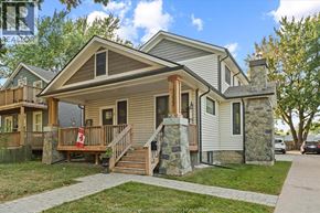 Windsor apartment for rent - A house with a grey roof and a stone pillar in front.