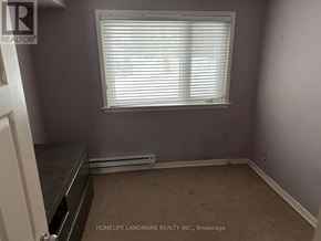 Toronto (Bayview Village) apartment for rent - A room with a window and a radiator on the floor.