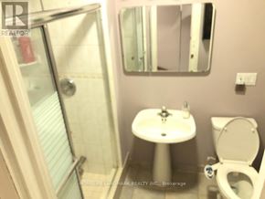 Toronto (Bayview Village) apartment for rent - A white sink with a toilet and a shower in a bathroom.