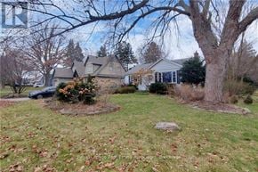Burlington (Lasalle) apartment for rent - A house with a tree in front of it.