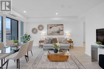 Toronto (Waterfront Communities) condo for rent - A modern living room with a glass table and a grey sofa.