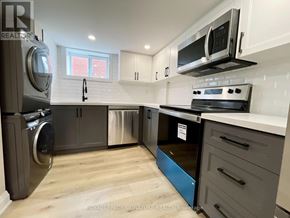 Hamilton (Inch Park) apartment for rent - A kitchen with a stainless steel refrigerator, oven, and microwave.