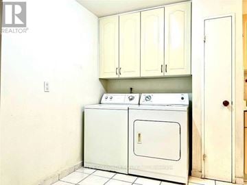 Toronto (L'amoreaux) condo for rent - A white oven and stove in a kitchen.