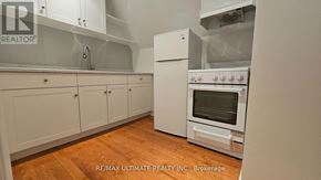 Toronto (Dovercourt-Wallace Emerson-Junction) apartment for rent - A white oven with a glass door is in a kitchen.